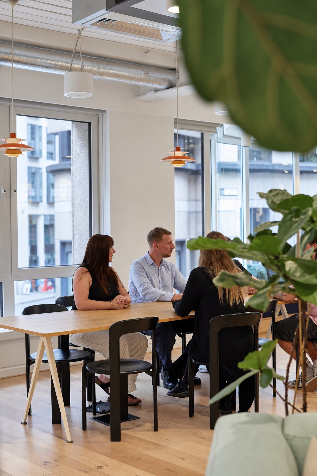 The Taxflow Partners team around the office table
